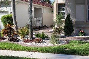A white gravel garden in front of a house.