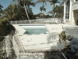 A pool that has been cleaned and is being worked on.